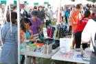 Festival visitors can vist the Information Booth to pick up festival swag.